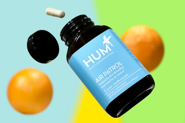 HUM空中巡逻维生素C补充免疫旁边的彩色背景橘子